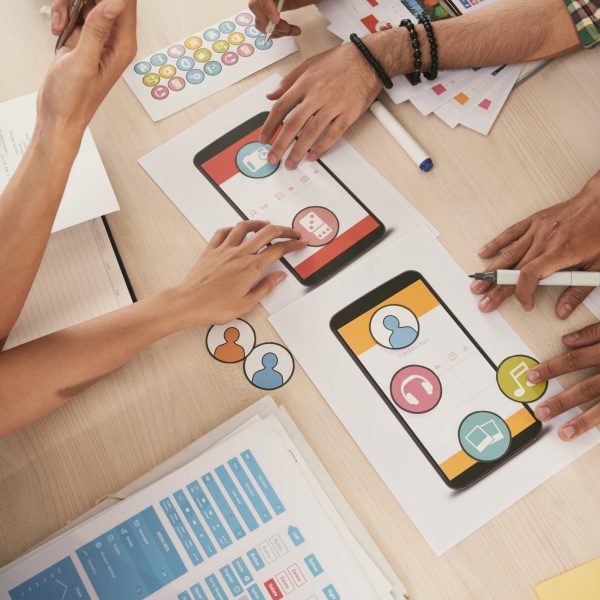 Mobile app developers choosing icons for interface