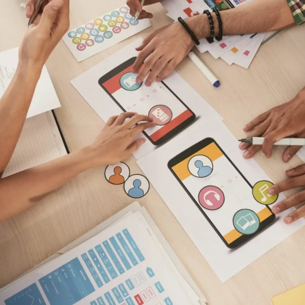 Mobile app developers choosing icons for interface